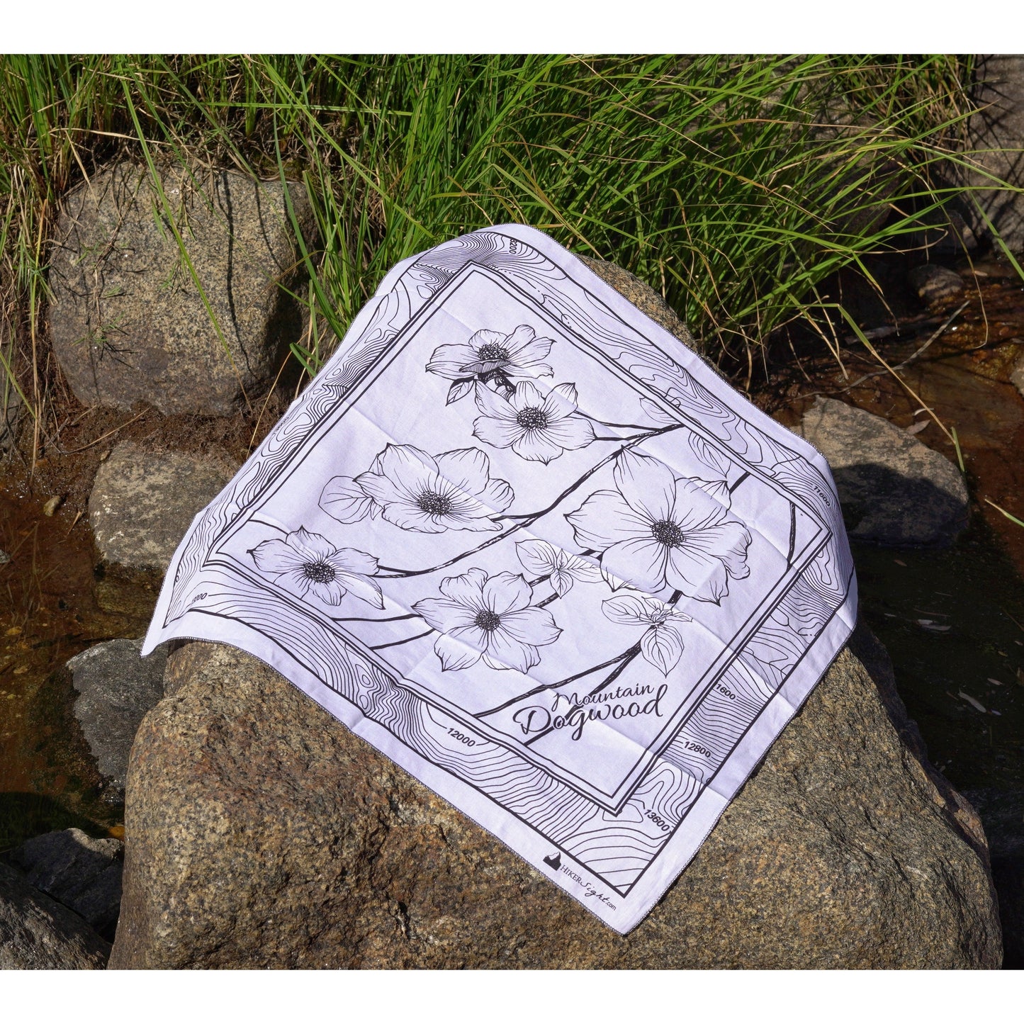 Mountain Dogwood Cotton Bandana on the rocks by a stream | Hiker Sight